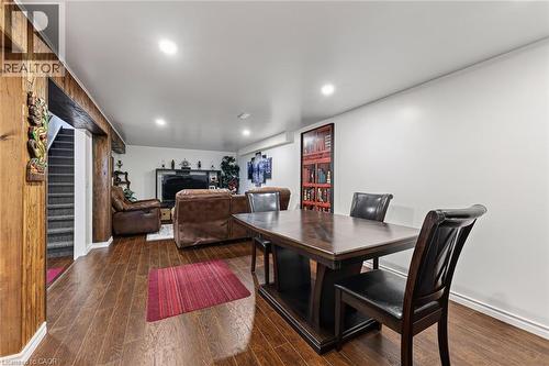 Finished basement space featuring wood-finish flooring, recessed lighting, and a neutral color palette - 184726 Cornell Road, Tillsonburg, ON - Indoor