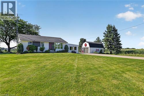 Ranch-style residence featuring a white exterior and a dark shingled roof - 184726 Cornell Road, Tillsonburg, ON - Outdoor