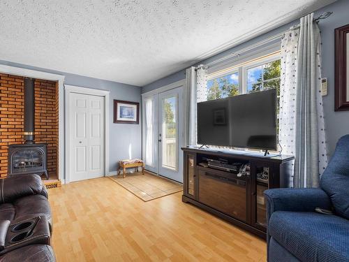 59 Vail Court, Stanhope, PE - Indoor Photo Showing Living Room With Fireplace