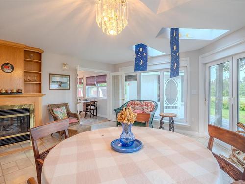 78 Lady Slipper Lane, Murray River, PE - Indoor Photo Showing Dining Room With Fireplace