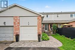 Single attached garage and stone walkway - 