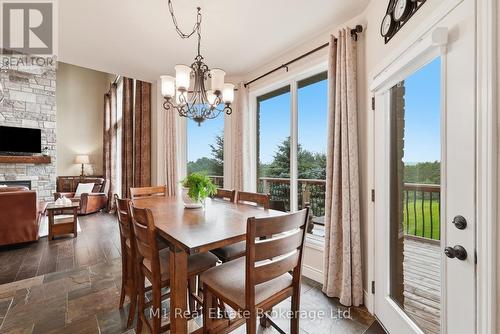 88 Conservation Trail, Centre Wellington (Belwood), ON - Indoor Photo Showing Dining Room With Fireplace