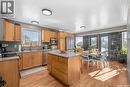 808 Lakeridge Drive, Buckland Rm No. 491, SK  - Indoor Photo Showing Kitchen With Double Sink 