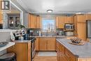 808 Lakeridge Drive, Buckland Rm No. 491, SK  - Indoor Photo Showing Kitchen With Double Sink 