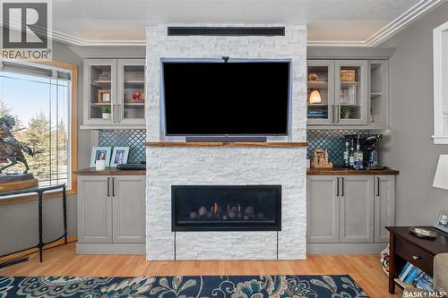 808 Lakeridge Drive, Buckland Rm No. 491, SK - Indoor Photo Showing Living Room With Fireplace