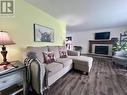 4 Elmwood Crescent, Pasadena, NL  - Indoor Photo Showing Living Room With Fireplace 
