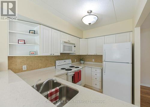 Kitchen - Unit 201 - 115 Bond Street, Orillia, ON - Indoor Photo Showing Kitchen With Double Sink