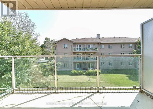 Garden views - Unit 201 - 115 Bond Street, Orillia, ON - Outdoor With Balcony