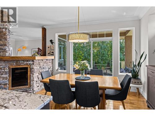 Dining Room - 1635 Gregory Road, West Kelowna, BC - Indoor Photo Showing Dining Room With Fireplace