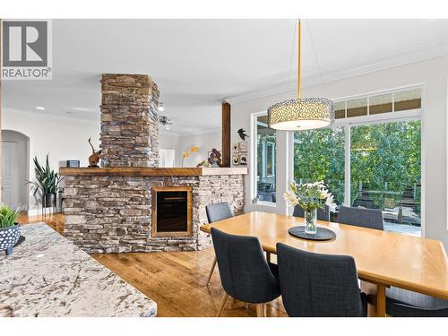 Dining Room - 1635 Gregory Road, West Kelowna, BC - Indoor Photo Showing Dining Room With Fireplace