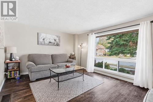 partially vitrually staged - 99 Emma Street, Guelph (General Hospital), ON - Indoor Photo Showing Living Room