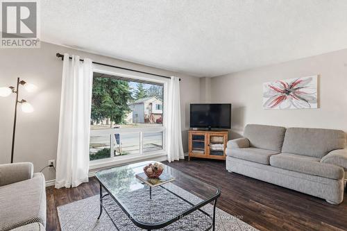 partially virtually staged - 99 Emma Street, Guelph (General Hospital), ON - Indoor Photo Showing Living Room