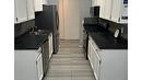 202-555 Rowcliffe Avenue, Kelowna, BC  - Indoor Photo Showing Kitchen With Double Sink 