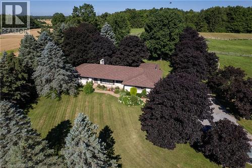Ranch-style residence on an expansive lot with mature trees and a gravel driveway - 269 Brant County Road 22, Ancaster, ON - Outdoor With View