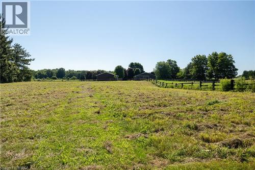 Expansive open field with scattered green growth and distant treelines - 269 Brant County Road 22, Ancaster, ON - Outdoor With View