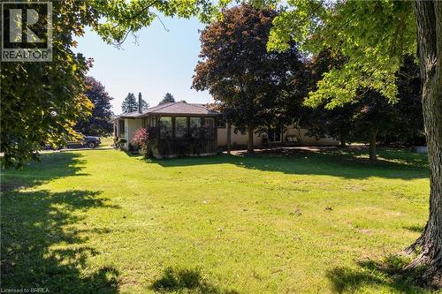 Expansive lawn area with mature trees and a single-story residence featuring a bay window extension - 269 Brant County Road 22, Ancaster, ON - Outdoor
