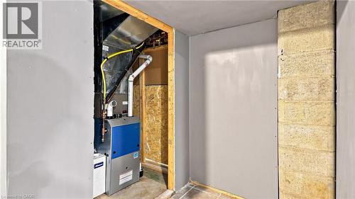 Dedicated utility area featuring a modern furnace unit with associated ductwork and piping - 524 Dorval Drive, Ancaster, ON - Indoor Photo Showing Other Room