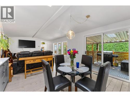 Cozy and bright main living space flows right out to the covered deck. - 610 Katherine Road Unit# 12, Kelowna, BC 