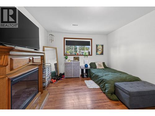 6750 Heffley Road, Kamloops, BC - Indoor Photo Showing Bedroom With Fireplace