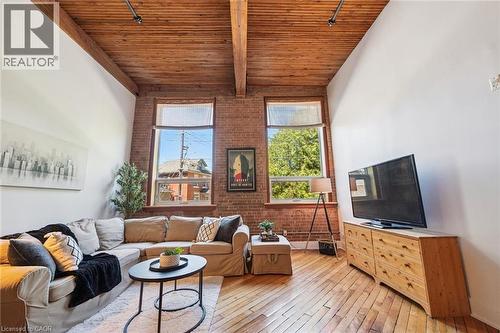 High ceilings featuring exposed wood beams and planking - 26 Ontario Street Unit# 127, Guelph, ON - Indoor Photo Showing Living Room