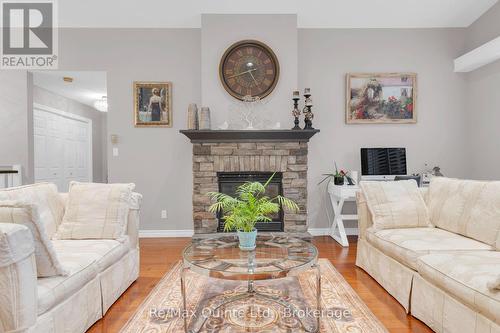 5 Hickory Court, Brighton, ON - Indoor Photo Showing Living Room With Fireplace