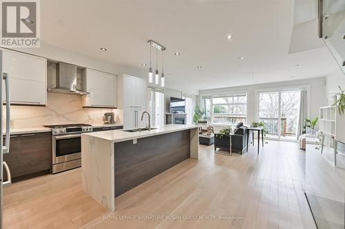 Chef's kitchen combined with family room - 69 Holmstead Avenue, Toronto, ON - Indoor Photo Showing Kitchen With Upgraded Kitchen