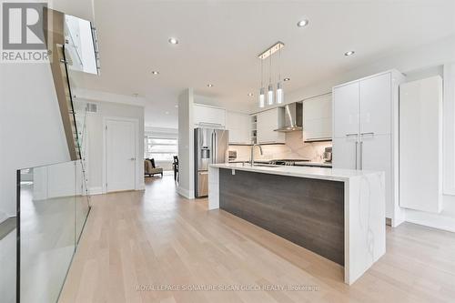 Waterfall island / breakfast bar - 69 Holmstead Avenue, Toronto, ON - Indoor Photo Showing Kitchen With Upgraded Kitchen