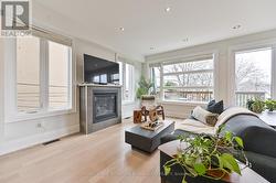 Family room with w/o to deck + cozy gas fireplace - 