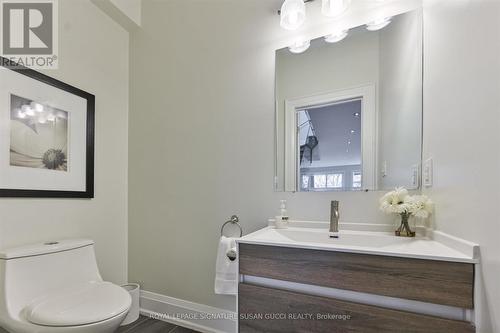 Tucked away main floor powder room - 69 Holmstead Avenue, Toronto, ON - Indoor Photo Showing Bathroom