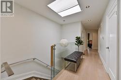 Wide hall on 2nd level w skylight - 