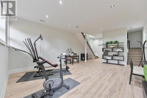 Lower level is sun filled and has walk out access - 69 Holmstead Avenue, Toronto, ON - Indoor Photo Showing Gym Room