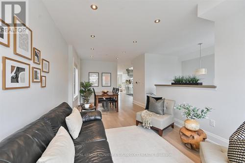 Living room O/L dining for seamless entertaining - 69 Holmstead Avenue, Toronto, ON - Indoor Photo Showing Living Room