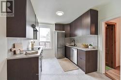 Kitchen/or 2nd bdrm 2nd flr (virtually staged) - 