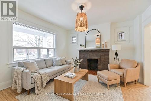 Living room (virtually staged) - 669 Greenwood Avenue, Toronto, ON - Indoor Photo Showing Living Room With Fireplace