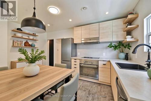 Kitchen main flr (virtually staged) - 669 Greenwood Avenue, Toronto, ON - Indoor