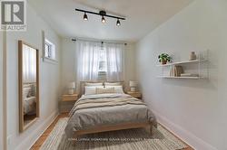 Bedroom 1 main flr or office (virtually staged) - 