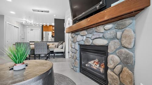 202-2050 Summit Drive, Panorama, BC - Indoor Photo Showing Living Room With Fireplace