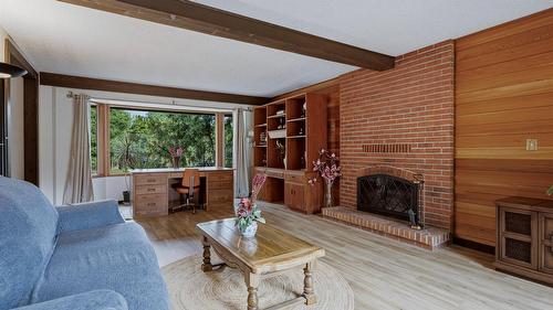 7603 De Jong Drive, Coldstream, BC - Indoor Photo Showing Living Room With Fireplace