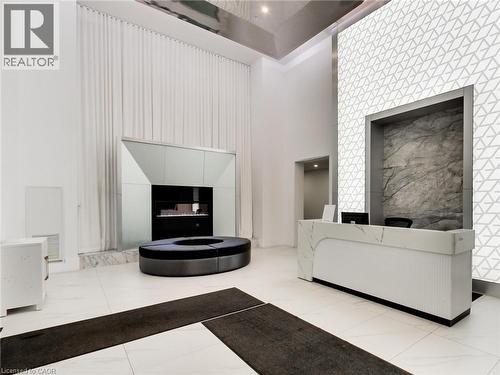 16 Concord Place Unit# 318, Grimsby, ON - Indoor With Fireplace