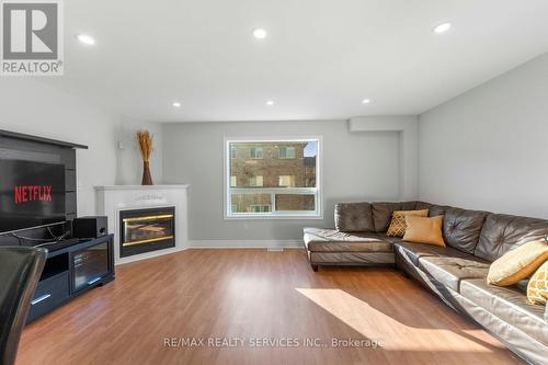 69 - 80 Acorn Place, Mississauga, ON - Indoor Photo Showing Living Room With Fireplace