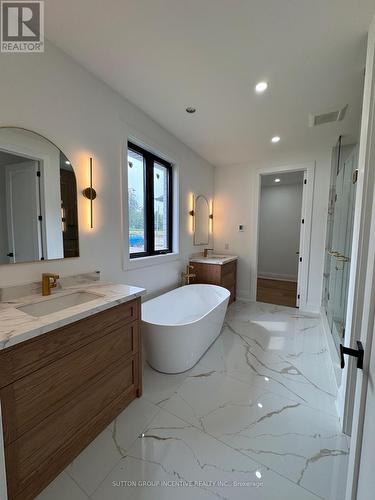 Ensuite Soaker Tub,Double Vanity, access to closet - 5 Jean Miller Court, Springwater, ON - Indoor Photo Showing Bathroom