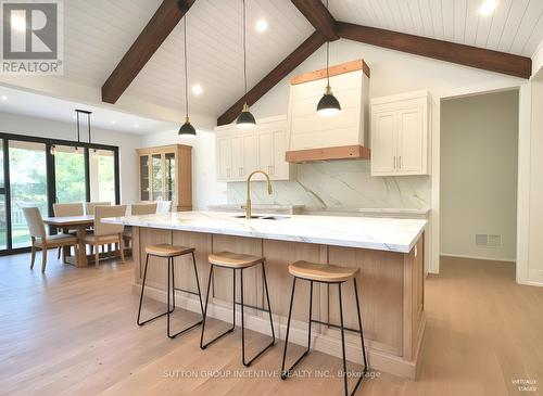 AI Generated Concept - Kitchen and Dinette Area - 5 Jean Miller Court, Springwater, ON - Indoor Photo Showing Kitchen With Upgraded Kitchen