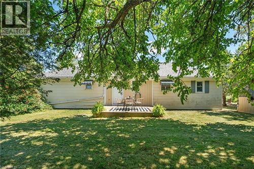 Spacious backyard featuring a manicured lawn and mature trees providing natural shade - 3 Bousfield Lane, Jarvis, ON - Outdoor