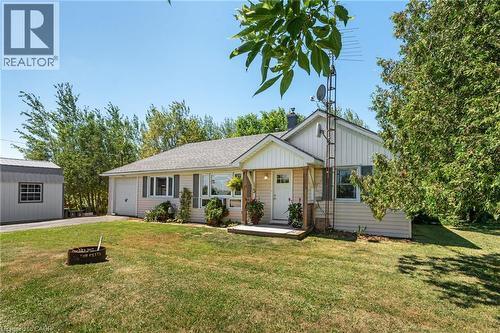 Ranch-style residence featuring light-colored siding and a covered front entry - 3 Bousfield Lane, Jarvis, ON - Outdoor