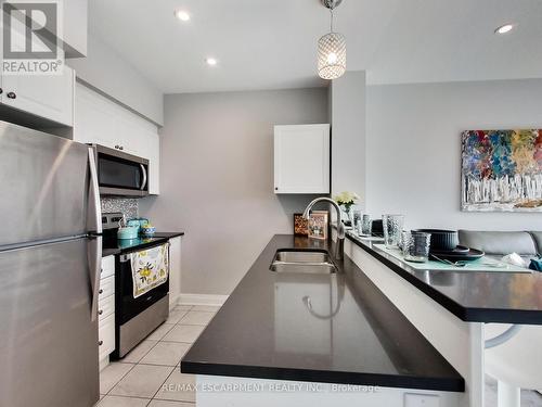 318 - 16 Concord Place, Grimsby, ON - Indoor Photo Showing Kitchen With Double Sink With Upgraded Kitchen