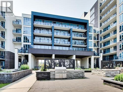 318 - 16 Concord Place, Grimsby, ON - Outdoor With Balcony With Facade