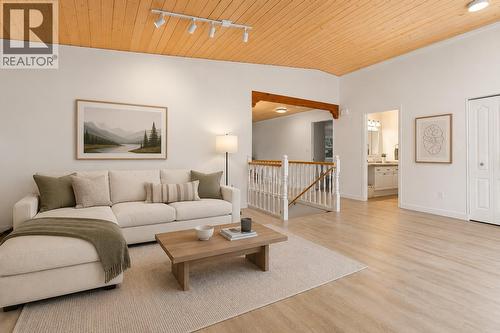 Main floor this picture digitally staged - 1587 Pratico Road, Revelstoke, BC - Indoor Photo Showing Living Room