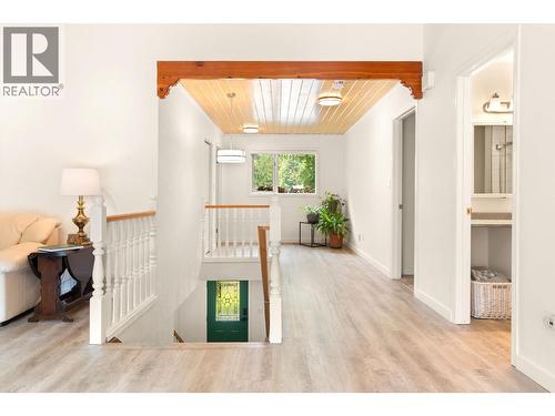 Tons of natural light main floor - 1587 Pratico Road, Revelstoke, BC - Indoor Photo Showing Other Room