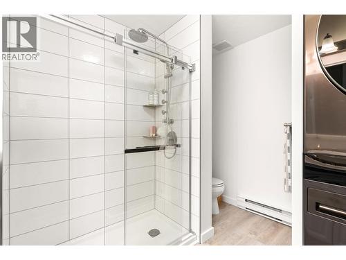 Laundry in main floor bathroom - 1587 Pratico Road, Revelstoke, BC - Indoor Photo Showing Bathroom