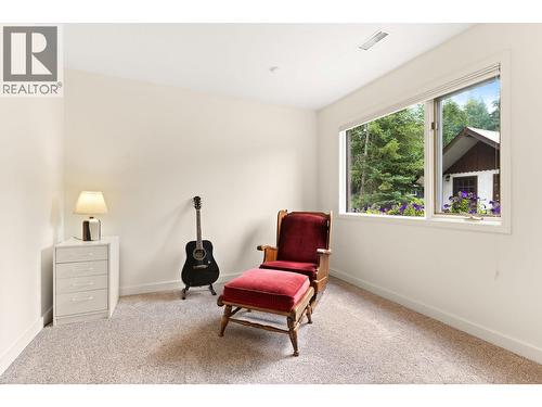 Bedroom 2 lower level, large windows - 1587 Pratico Road, Revelstoke, BC - Indoor